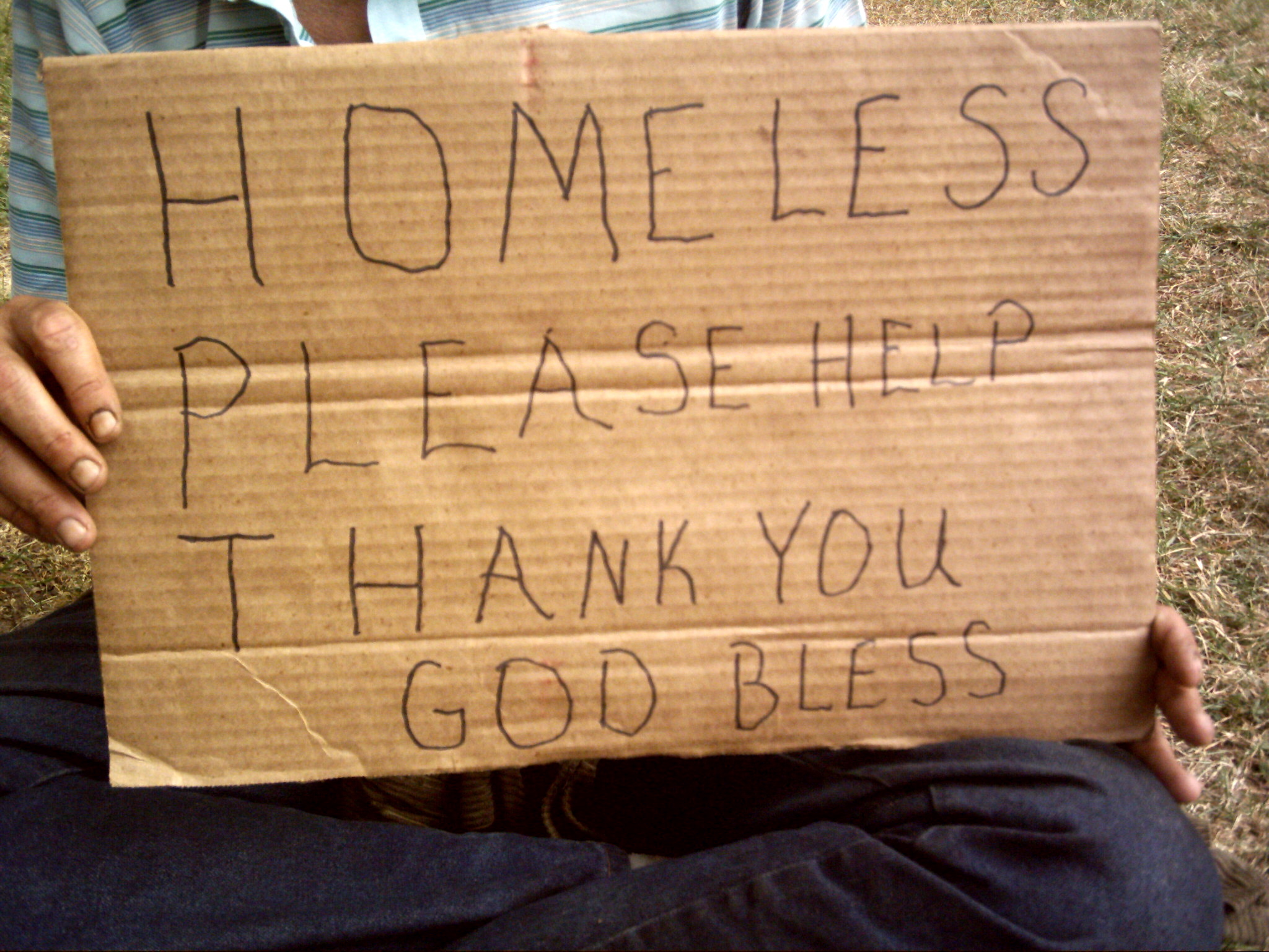 "homeless - please help" sign